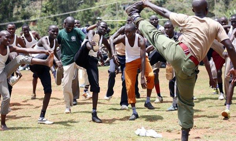 Prospective police recruits are guided during a physical exercise session at Kabarnet Stadium in Baringo Central on April 20, 2015.
