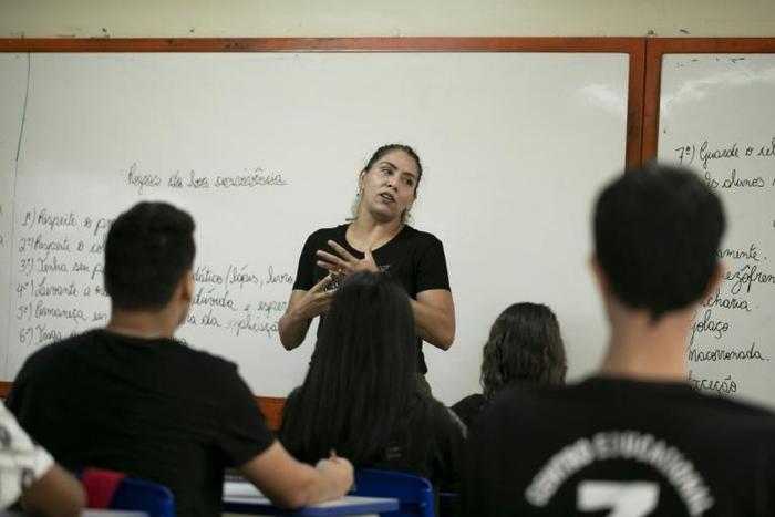 Teacher Karla Souza, who is against police presence in schools, gives class at the Education Center 07 of Ceilandia, near Brasilia which takes part in a pilot project of joint management between the Brazilian Secretariats of Education and Public Securi...