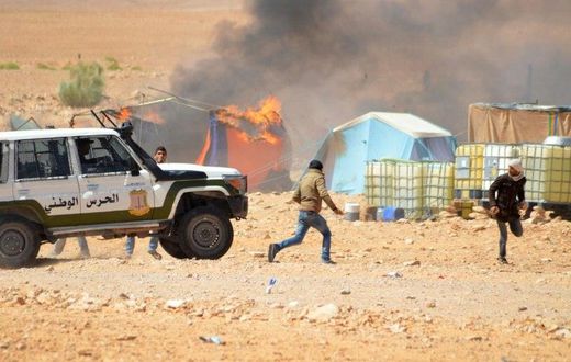 Tunisian protesters comfront security forces outside the El Kamour oil and gas pumping station, in the southern state of Tataouine, on May 22, 2017