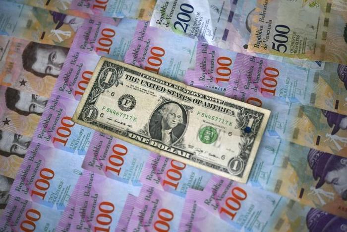 The adoption of the dollar has been creeping in for months as Venezuela's jaw-dropping inflation meant the use of its bolivar currency is largely restricted to purchases by debit cards or bank transfers