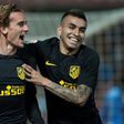 Atletico Madrid's Antoine Griezmann (L) celebrates with teammate Angel Correa after scoring during their Spanish La Liga match against Granada, at Nuevo Los Carmenes stadium in Granada, on March 11, 2017