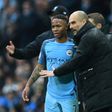 Manchester City's manager Pep Guardiola (R) speaks to midfielder Raheem Sterling during their English Premier League match against Liverpool, at the Etihad Stadium in Manchester, on March 19, 2017
