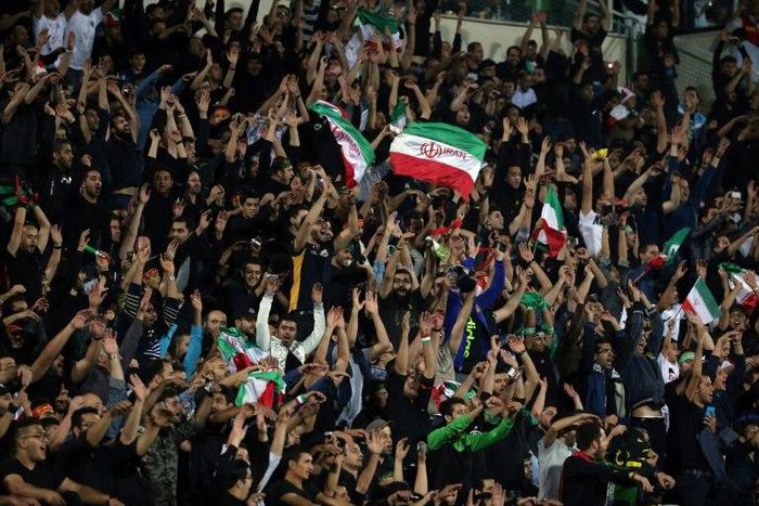 Iran's supporters celerbate their opening goal during the 2018 World Cup qualifying football match between Iran and South Korea at the Azadi Stadium in Tehran on October 11, 2016