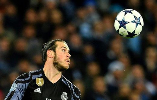 Real Madrid's forward Gareth Bale eyes the ball during the UEFA Champions League football match against SSC Napoli on March 7, 2017