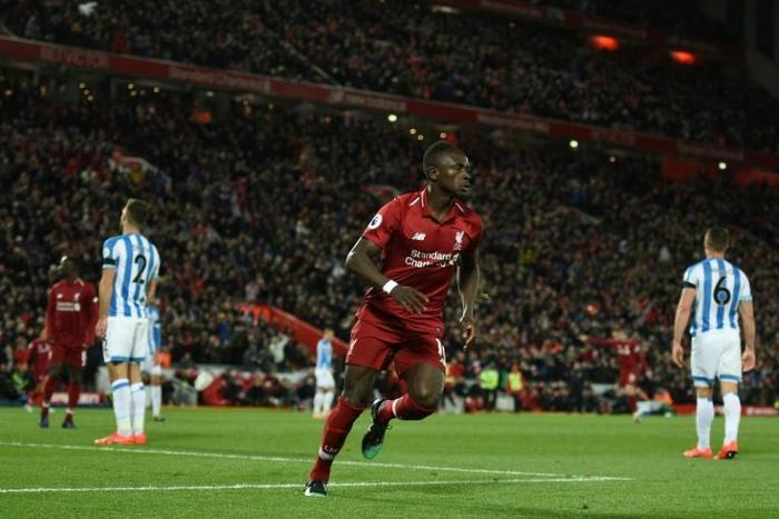 Liverpool's Sadio Mane celebrates scoring in the rout of Huddersfield