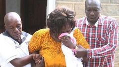 Family members overcome by grief during the burial of Collins Kipyegon Kalya