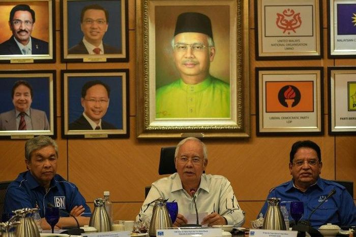 Malaysia's Prime Minister Najib Razak (C) speaks during a press conference in Kuala Lumpur on March 29, 2017