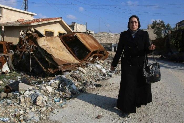 Kafa Jawish returns to her home in east Aleppo four years after leaving as rebels entered the city
