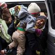 Central American refugees wait near the US-Mexico border as they seek asylum in the United States