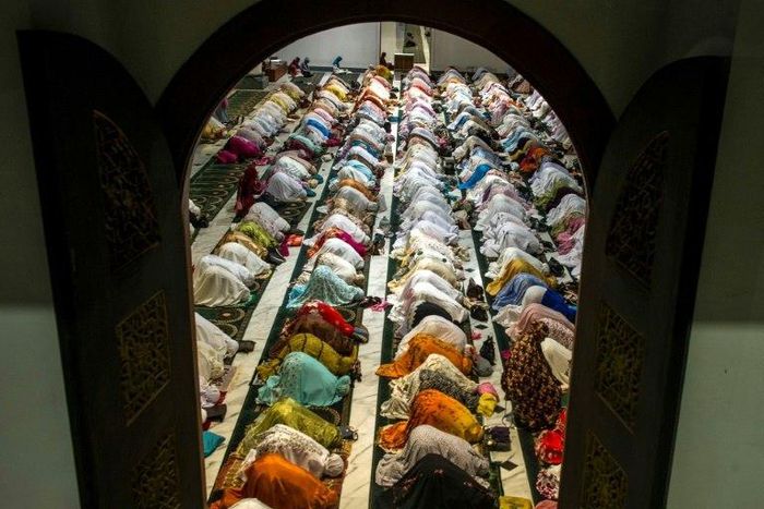 Indonesian Muslims pray during the start of the holy month of Ramadan. More than 1.5 billion Muslims around the world will mark the month, during which believers abstain from eating, drinking, and smoking from dawn until sunset