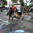 Opposition demonstrators clash with riot police in Caracas, on May 24, 2017