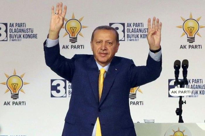 Turkish President Tayyip Erdogan waves to supporters during an extraordinary congress of the ruling AK Party (AKP) in Ankara, on May 21, 2017