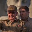 Cuban President Raul Castro, next to his grandson and bodyguard, attends the May Day parade in Havana on May 1, 2017