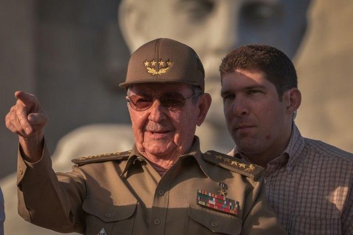 Cuban President Raul Castro, next to his grandson and bodyguard, attends the May Day parade in Havana on May 1, 2017