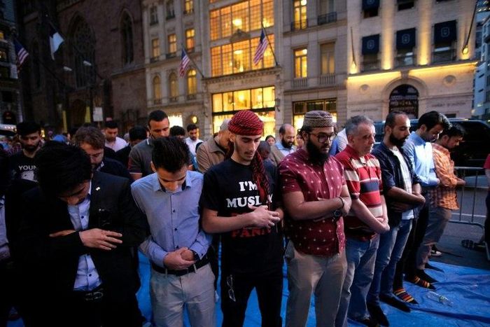 Muslims pray on Fifth Avenue near Trump Tower in New York, after Iftar, breaking fast during the holy month of Ramadan on June 1, 2017