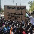 Members of the Niger Front for the Restoration of Democracy and the Defence of the Republic, hold a placard reading "Rebirth, corruption, injustice, looting", as they protest in Niamey on March 4, 2017