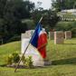 A French flag is draped over a memorial at the Stanley Military Cemetery, dedicated to French civilians who died fighting with the Hong Kong Volunteer Defence Corps against the 1941 Japanese invasion of the territory