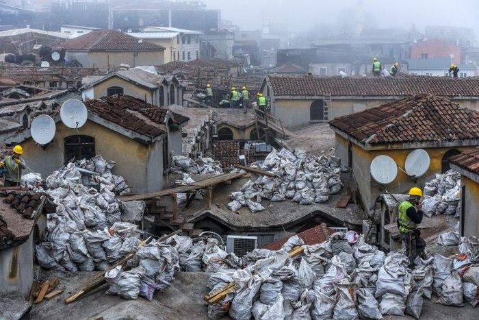 Workers on the roof of Istanbul's iconic marketplace, the Grand Bazaar undergoing renovation.