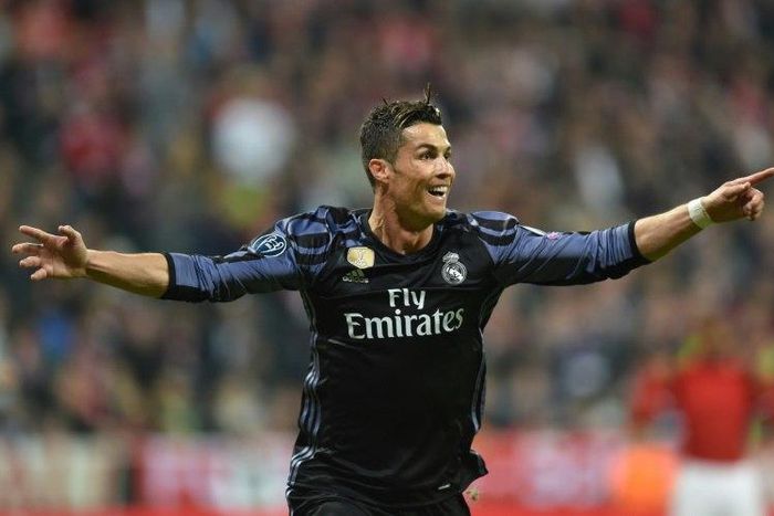 Real Madrid's forward Cristiano Ronaldo reacts after scoring during the UEFA Champions League 1st leg quarter-final football match against Bayern Munich April 12, 2017