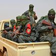 Malian army soldiers, pro-government militia members and former rebels, predominantly Tuaregs, take part in their first joint patrol in Gao in northern Mali on February 23, 2017