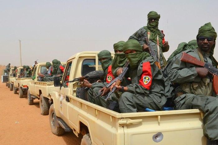 Malian army soldiers, pro-government militia members and former rebels, predominantly Tuaregs, take part in their first joint patrol in Gao in northern Mali on February 23, 2017