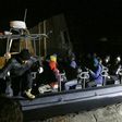 Libyan coastguards help migrants who were rescued at sea off the coast of Tripoli, on February 5, 2017
