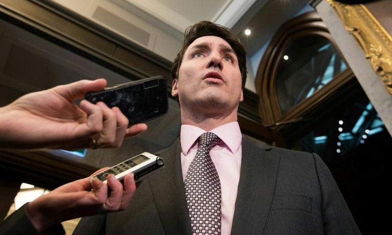 Prime Minister Justin Trudeau speaks to reporters before Question Period in the Canadian Parliament in late February 2019