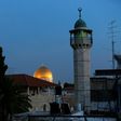 The minaret of a mosque and the Dome of the Rock in a Palestinian neighbourhood in east Jerusalem's Old City