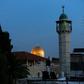 The minaret of a mosque and the Dome of the Rock in a Palestinian neighbourhood in east Jerusalem's Old City
