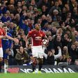 English referee Michael Oliver (R) shows a red card to Manchester United's Spanish midfielder Ander Herrera (L) during their match against Chelsea in London on March 13, 2017