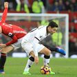 Manchester United's midfielder Ander Herrera (L) challenges Watford's midfielder Mauro Zarate (R) during the English Premier League football match February 11, 2017