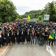 Demonstrators and lawyers stand during a protest over security and the state of the economy near the Centre Spatial Guyanais on April 4, 2017 in Kourou, French Guiana