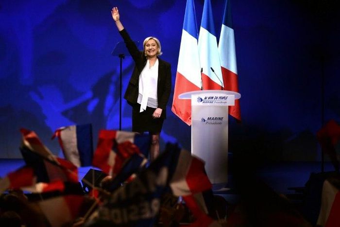 French far-right Front National (FN) party candidate for the presidential election Marine Le Pen acknowledges applause after speaking on stage during a campaign rally at the Zenith de Nantes venue in Saint-Herblain on February 26, 2017
