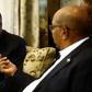 Kenyan President Uhuru Kenyatta (L) speaks with his Sudanese counterpart Omar al-Bashir during their meeting in Khartoum on October 29, 2016