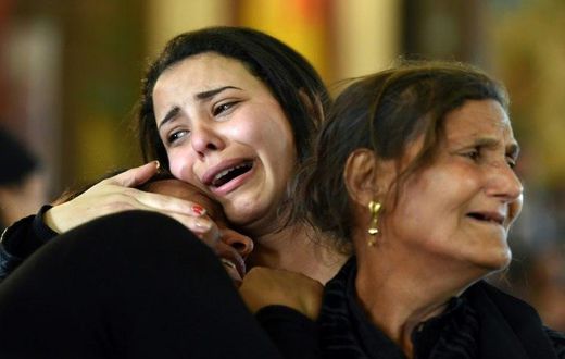 Women mourn the victims of a bombing at the Coptic Christian Saint Mark's church in Alexandria during a funeral procession in Borg El-Arab, east of the city, on April 10, 2017