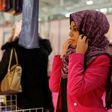 A visitor trying on a headscarf Annual Meeting of France's Muslims in 2015 north of Paris