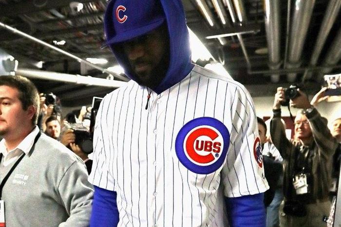 LeBron James #23 of the Cleveland Cavaliers enters the United Center in a Chicago Cubs uniform after losing a World Series bet with Dwyane Wade of the Chicago Bulls on December 2, 2016 in Chicago, Illinois