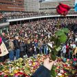 People attend a memorial ceremony on April 9, 2017 at Sergels Torg plaza in Stockholm, close to the point where a truck drove into a department store two days before