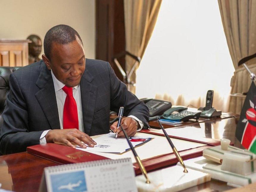 President Uhuru Kenyatta during a past signing. 14% interest rate cap for banks flops as MPs fail to meet quorum during debate