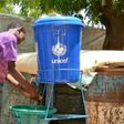 Children wash their hands in a camp for internally displaced people in Diffa, Niger, on August 17, 2016