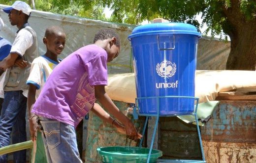 Children wash their hands in a camp for internally displaced people in Diffa, Niger, on August 17, 2016
