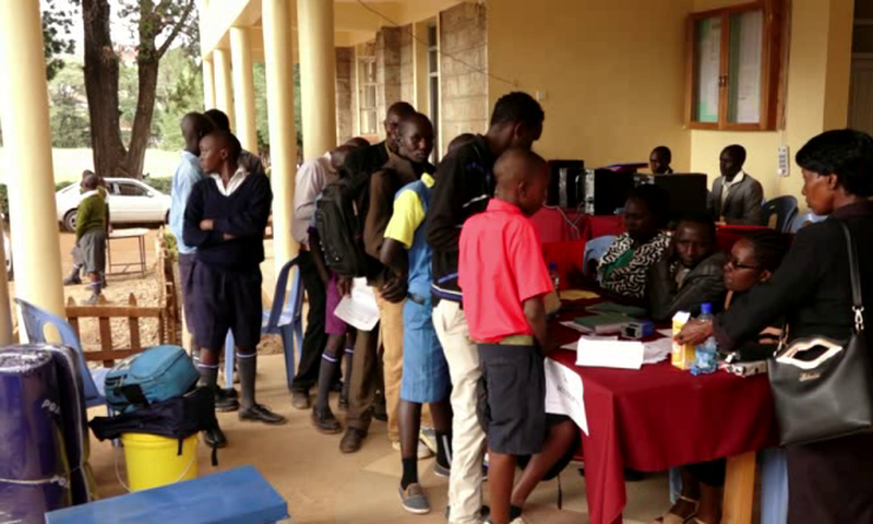 Parents and students during the Form 1 admission process at a Kenyan secondary school (Twitter)