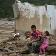 A man and his daughter remain amid rubble in Mocoa, Putumayo department, Colombia on April 4, 2017