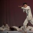 A former member of an armed group, Dereck Anderson (C), performs during the Victus II Memory theater project, in Bogota on May 11, 2017