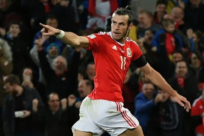Wales' forward Gareth Bale celebrates after scoring the opening goal of the World Cup 2018 qualification match between Wales and Serbia at Cardiff City stadium in Cardiff on November 12, 2016