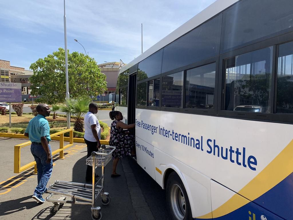 Friends and family members of passengers of Ethiopian Airlines ET302 board a shuttle to an emergency centre at the JKIA