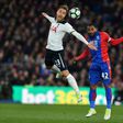 Tottenham Hotspur's Christian Eriksen (L) heads the ball away from Crystal Palace's Jason Puncheon during the match at Selhurst Park in south London on April 26, 2017
