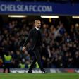 Manchester City manager Pep Guardiola crosses the pitch following his side's English Premier League match against Chelsea at Stamford Bridge in London on April 5, 2017