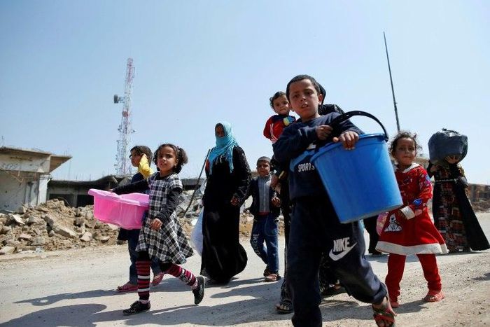 Iraqis fleeing Mosul's old city, where the coalition says IS group fighters are trying to increase the civilian casualty rate