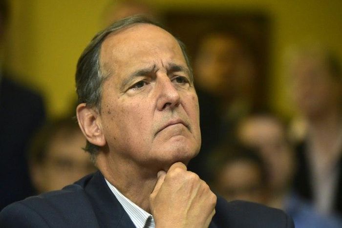 The representative of the Colombian government Juan Camilo Restrepo gestures during a press conference in Sangolqui, Ecuador on April 6, 2017, within peace talks between the Colombian government and the ELN